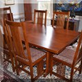 F01. Stickley mission trestle keyhole dining table with 6 chairs. (Includes pads) 76"w 
